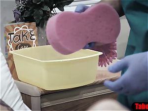 doctor gives patient a sponge bath and vaginal examine