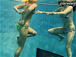 2 magnificent amateurs displaying their bodies off under water